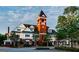 Unique exterior view of a two-story building with a classic brick tower and white siding at 1120 Starline Dr, Smyrna, GA 30080
