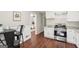 Well-lit kitchen with stainless steel appliances and granite countertops conveniently located adjacent to the living room area at 1120 Starline Dr, Smyrna, GA 30080