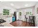 Bright kitchen with white cabinetry, granite countertops, stainless appliances, and a view to the outdoor patio space at 1120 Starline Dr, Smyrna, GA 30080