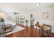 Open-concept living room featuring hardwood floors, modern decor, and seamless transition to the kitchen area at 1120 Starline Dr, Smyrna, GA 30080