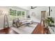 Cozy living room with a large window offering lush green views, comfortable seating, and stylish interior design at 1120 Starline Dr, Smyrna, GA 30080