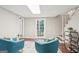 Well-lit living room boasts hardwood floors, access to a backyard, and cozy seating at 1120 Starline Dr, Smyrna, GA 30080