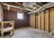 Unfinished basement with exposed ductwork and concrete floor, offering potential for customization at 1120 Starline Dr, Smyrna, GA 30080