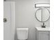 Bathroom featuring a vanity, decorative lighting, and ceramic toilet at 1120 Starline Dr, Smyrna, GA 30080