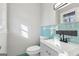 Bathroom vanity with light blue backsplash at 1120 Starline Dr, Smyrna, GA 30080