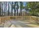 Backyard wooden deck provides outdoor living space, perfect for entertaining at 1120 Starline Dr, Smyrna, GA 30080