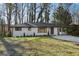 Charming single-story home with a white brick exterior and a well-manicured front yard at 1120 Starline Dr, Smyrna, GA 30080