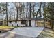 Charming single-story home with a white brick exterior and a well-manicured front yard at 1120 Starline Dr, Smyrna, GA 30080