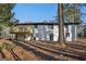 Exterior view of the home's backyard, featuring a deck and access to the lower level at 1120 Starline Dr, Smyrna, GA 30080