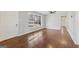 Bright living room featuring hardwood floors, fresh gray paint, a ceiling fan, and natural light from a large window at 1120 Starline Dr, Smyrna, GA 30080