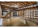 Unfinished basement with bare framing, exposed ceiling, and concrete floor, ready for customization at 20 King Pl, Stockbridge, GA 30281