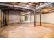 Unfinished basement showing concrete floor and walls, exposed ceiling, and support beams at 20 King Pl, Stockbridge, GA 30281