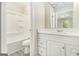 Bathroom features a tub and shower, with updated vanity and faucet at 20 King Pl, Stockbridge, GA 30281