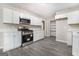 Updated kitchen with white cabinets, quartz countertops, and stainless steel appliances at 20 King Pl, Stockbridge, GA 30281