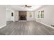 Spacious living room with brick fireplace, large windows, and new vinyl flooring at 20 King Pl, Stockbridge, GA 30281