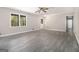 Bright living room with new vinyl flooring, ceiling fan and trim; filled with natural light at 20 King Pl, Stockbridge, GA 30281