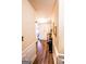 Bright hallway with wood floors, decorative wainscoting, and elegant decor at 386 Hill Crest Cir, Hiram, GA 30141