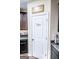 Close up of kitchen pantry with white door and storage at 386 Hill Crest Cir, Hiram, GA 30141