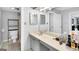 Bright bathroom with a vanity, large mirror, and storage space at 93 Rue Fontaine, Lithonia, GA 30038