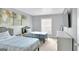 Serene bedroom features two twin beds, neutral decor, and a bright window for ample natural light at 93 Rue Fontaine, Lithonia, GA 30038