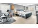Spacious bedroom featuring a tufted bed, workspace, and neutral color palette at 93 Rue Fontaine, Lithonia, GA 30038