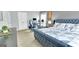 Cozy bedroom featuring a tufted bed, workspace, and ample natural light at 93 Rue Fontaine, Lithonia, GA 30038