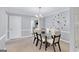 Elegant dining room featuring a glass-top table, seating for six, and decorative wall accents at 93 Rue Fontaine, Lithonia, GA 30038