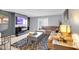 Open-concept living area showcases a comfortable sectional, modern decor, and abundant natural light at 93 Rue Fontaine, Lithonia, GA 30038