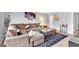 Comfortable living room with a large sectional sofa, decorative pillows, and a stylish rug at 93 Rue Fontaine, Lithonia, GA 30038