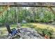 Outdoor patio with stone floors, pergola, and a view of the large, fenced backyard at 4735 Rabbit Farm Rd, Loganville, GA 30052