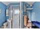 A blue bathroom including the glass shower and vanity area at 4735 Rabbit Farm Rd, Loganville, GA 30052