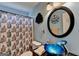Unique bathroom featuring custom sink, round mirror and tiled shower at 4735 Rabbit Farm Rd, Loganville, GA 30052