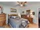 Bedroom featuring wood floors, natural light, ceiling fan and wood furniture at 4735 Rabbit Farm Rd, Loganville, GA 30052