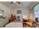 Bedroom featuring hardwood floors, natural light from the window, and personal touches at 4735 Rabbit Farm Rd, Loganville, GA 30052