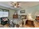 Bedroom with neutral walls, ceiling fan, and natural light from the window at 4735 Rabbit Farm Rd, Loganville, GA 30052