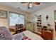 Bedroom with a ceiling fan, natural light, and a personal decor touches at 4735 Rabbit Farm Rd, Loganville, GA 30052