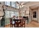 Bright breakfast nook with hardwood floors, large windows, and a ceiling fan, perfect for casual dining at 4735 Rabbit Farm Rd, Loganville, GA 30052