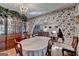 Charming dining room featuring hardwood floors, an elegant chandelier, and access to other living spaces at 4735 Rabbit Farm Rd, Loganville, GA 30052