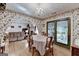Dining room with hardwood floors that connects to the living room and back patio creating a good flow at 4735 Rabbit Farm Rd, Loganville, GA 30052