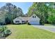 Charming one-story home featuring a well-manicured lawn and a two-car garage at 4735 Rabbit Farm Rd, Loganville, GA 30052
