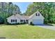 Charming one-story home featuring a well-manicured lawn and a two-car garage at 4735 Rabbit Farm Rd, Loganville, GA 30052