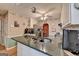A kitchen featuring a granite countertop island and stainless steel appliances at 4735 Rabbit Farm Rd, Loganville, GA 30052