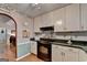 Well-lit kitchen with modern appliances and hardwood floors at 4735 Rabbit Farm Rd, Loganville, GA 30052
