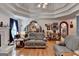 Cozy living room with hardwood floors, neutral furniture, and a fireplace, creating a warm and inviting ambiance at 4735 Rabbit Farm Rd, Loganville, GA 30052