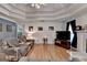 Comfortable living room with hardwood floors, fireplace, and large windows at 4735 Rabbit Farm Rd, Loganville, GA 30052