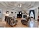 Spacious living room with tray ceiling, hardwood floors, and fireplace at 4735 Rabbit Farm Rd, Loganville, GA 30052