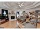Spacious living room with hardwood floors, tray ceiling and open to the dining area at 4735 Rabbit Farm Rd, Loganville, GA 30052
