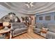 Open living room with hardwood floors, comfortable seating, and arched doorways creating an inviting space at 4735 Rabbit Farm Rd, Loganville, GA 30052