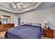 Primary bedroom showcasing hardwood floors, large windows, and a ceiling fan at 4735 Rabbit Farm Rd, Loganville, GA 30052