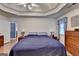 Primary bedroom with hardwood floors, ceiling fan and ensuite bathroom at 4735 Rabbit Farm Rd, Loganville, GA 30052